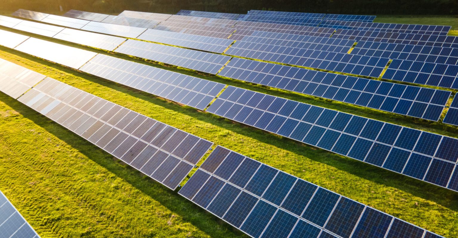 Solar power farm in the evening, fields of West Sussex, UK.